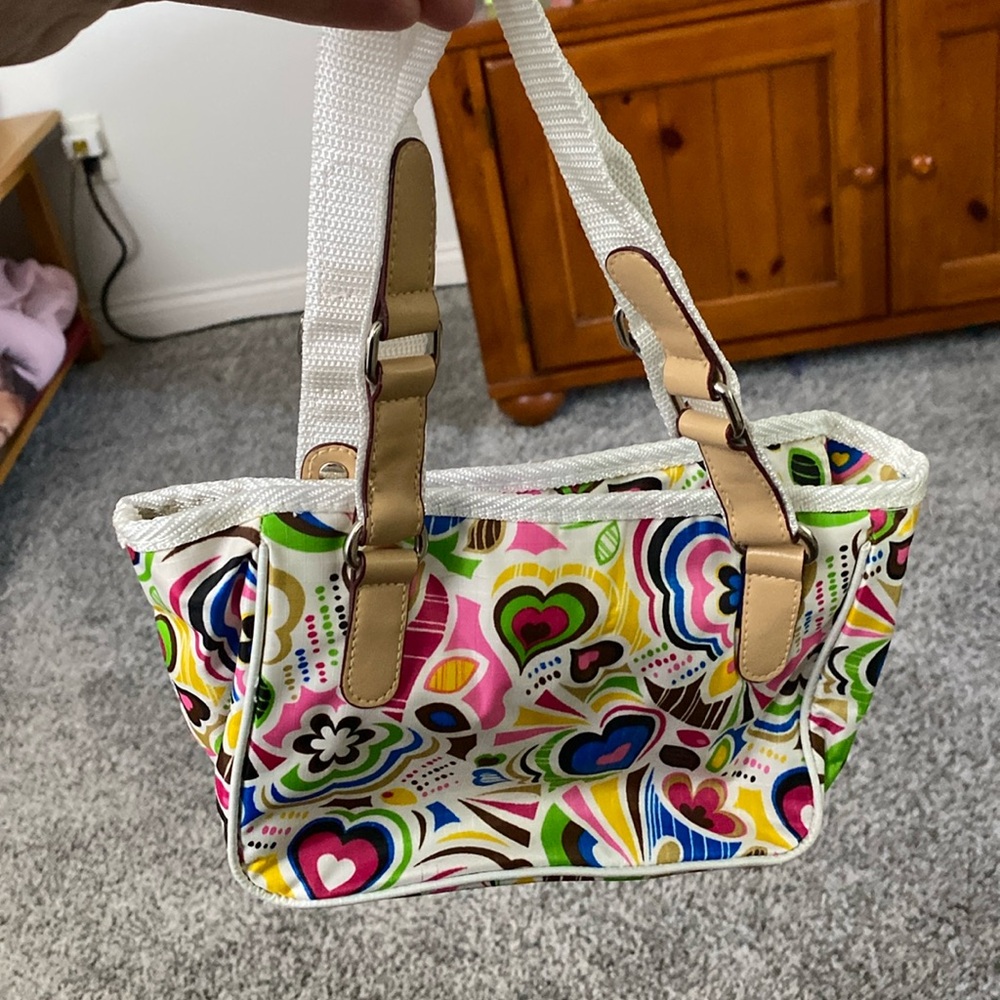 Abstract floral and heart detailed hand purse